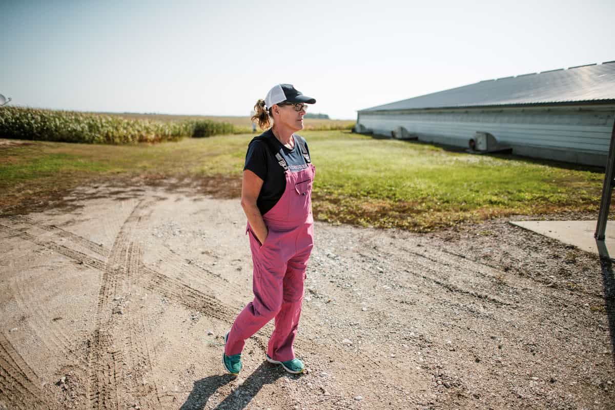 Iowa pig farmer Lisa Rasmussen walks as she works on her family farm