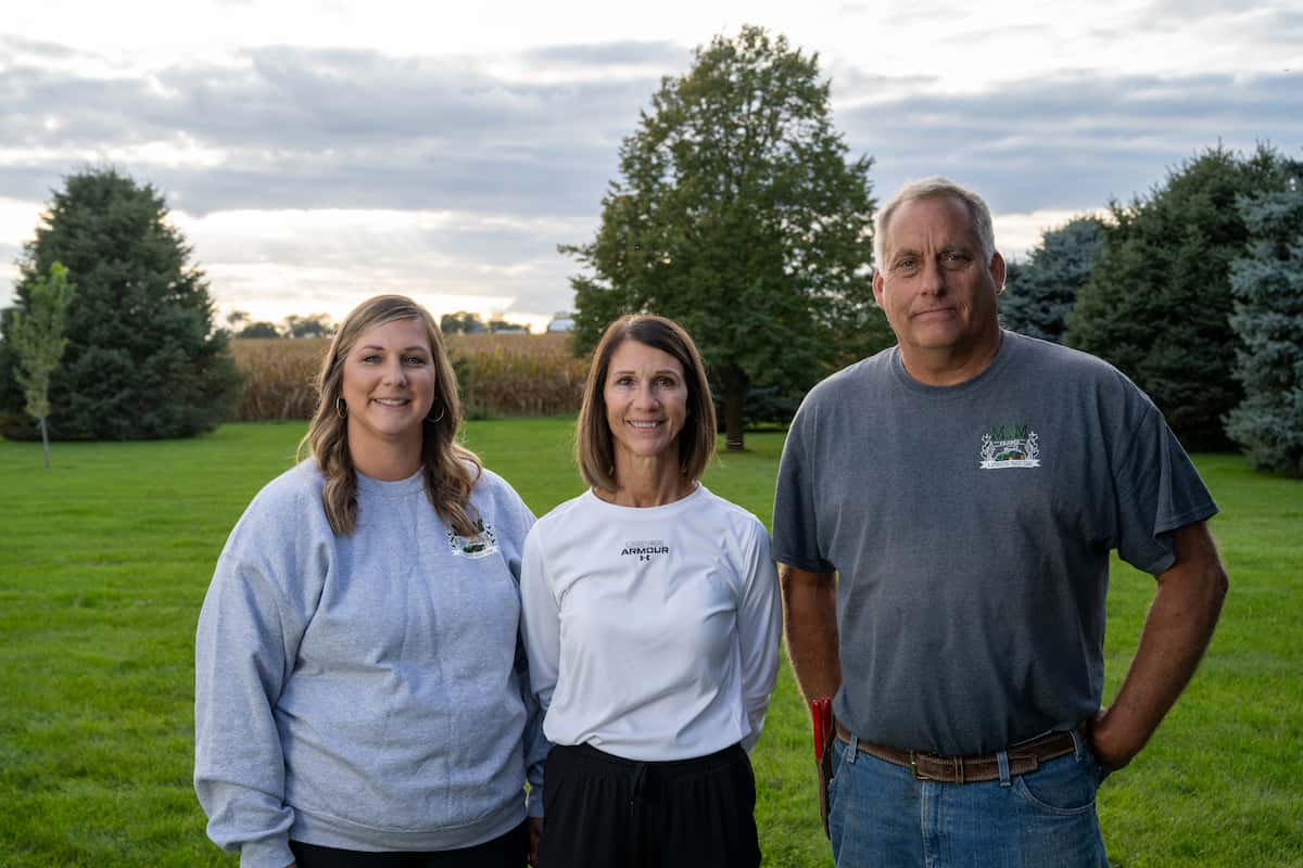 Schleisman family standing ina field.