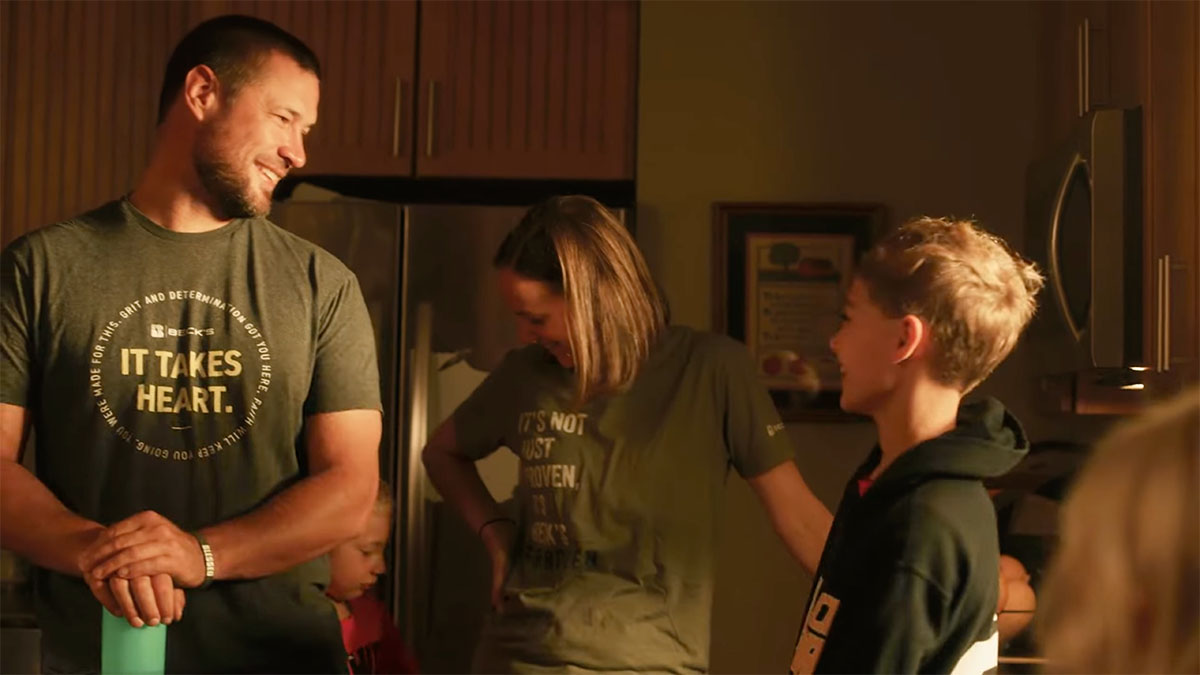 Matt and Melissa Ditch with their son on their family farm in Iowa