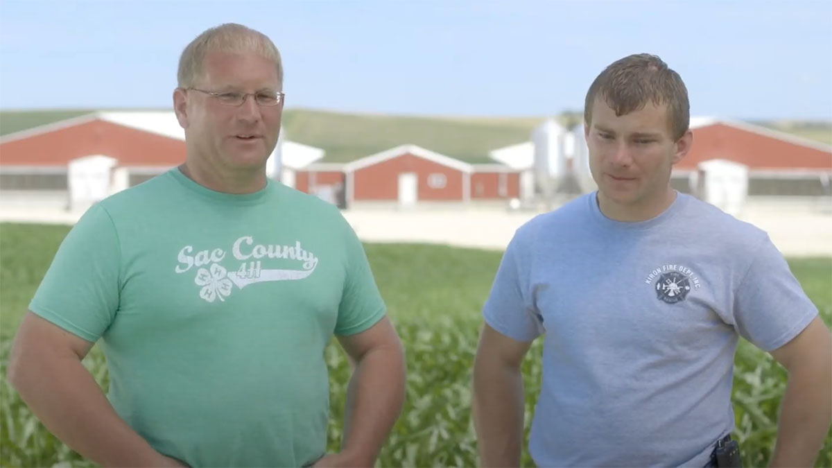Brothers Brian adn Brad Lundell standing in a corn field on their Iowa family farm, video thumbnail